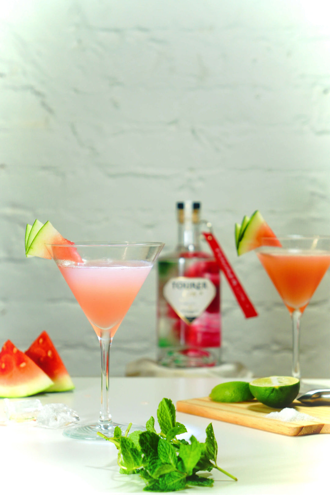 Watermelon flavoured gin southside cocktail with watermelon slice and mint sprig